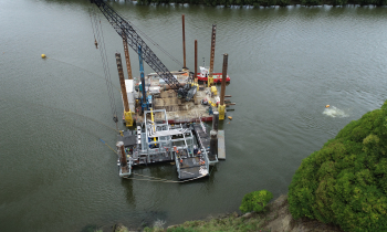 Floating pontoons on water with construction equipment
