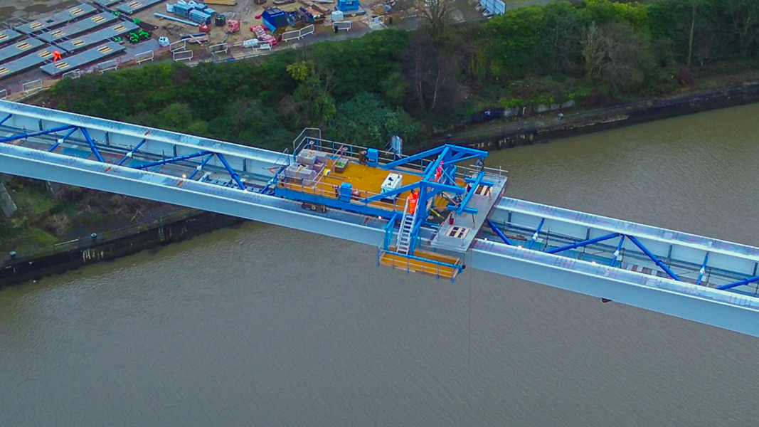 Workmen on footbridge