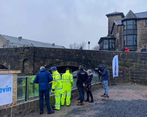 ITV BOrder, Cumberland Council , Kendal Town Council and EA representatives viewing the first glass panels.jpg