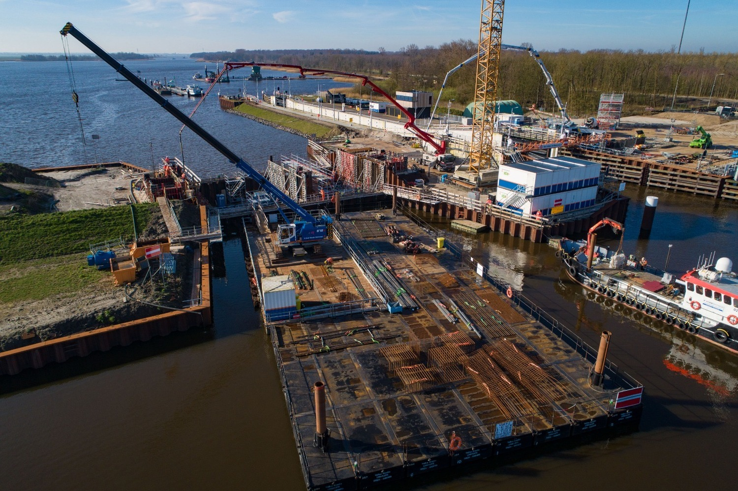 Crane on pontoons working on water