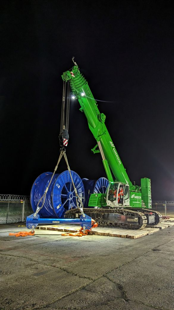Cable drum being lifted by an excavator on the Hornsea 3 project.