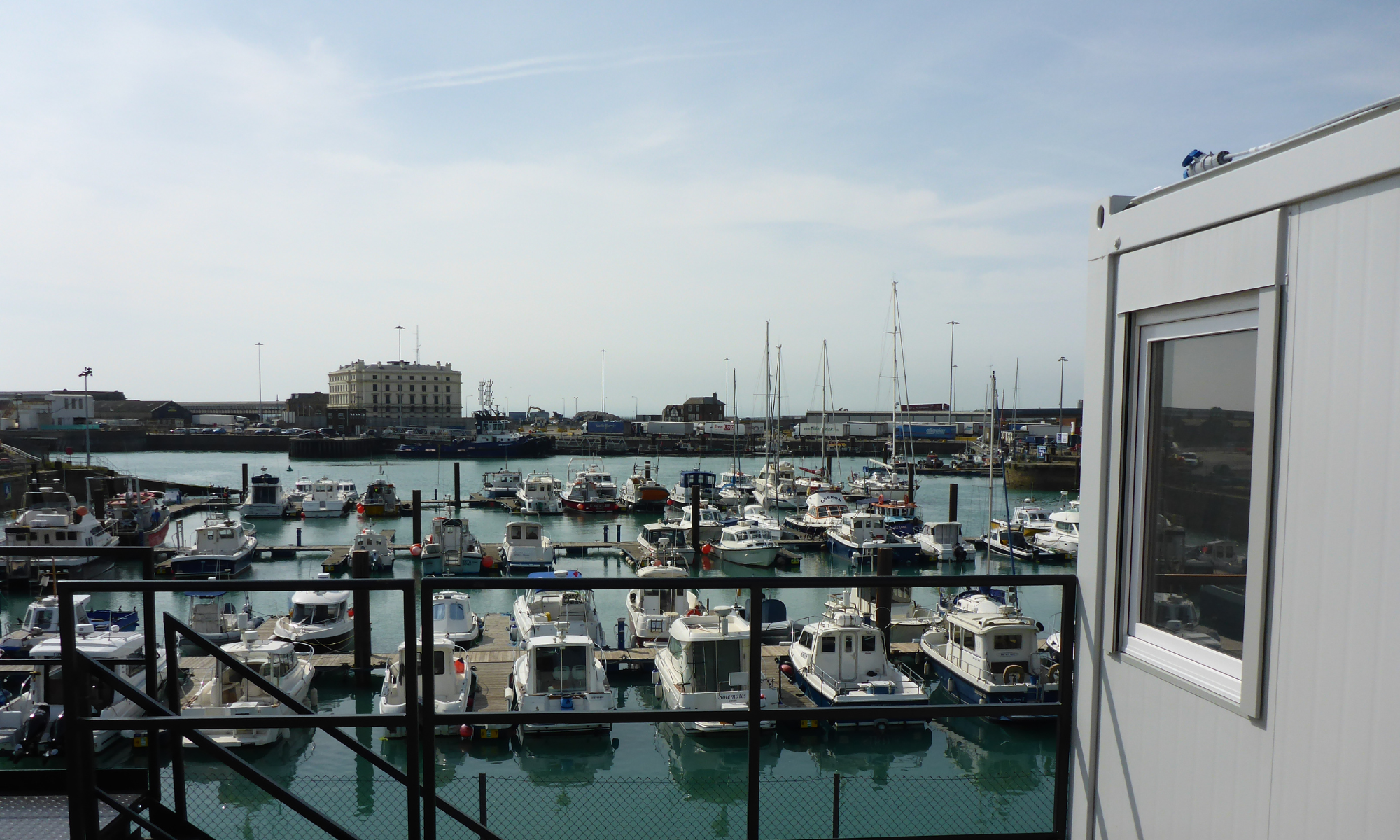 Balcony overlooking harbour of small boats at Dover Western Docks